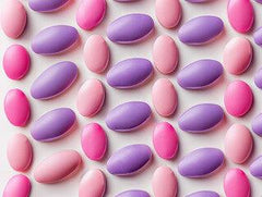 Pink and purple caplets of Naproxen Sodium or Ibuprofen combined with Omeprazole for stomach protection